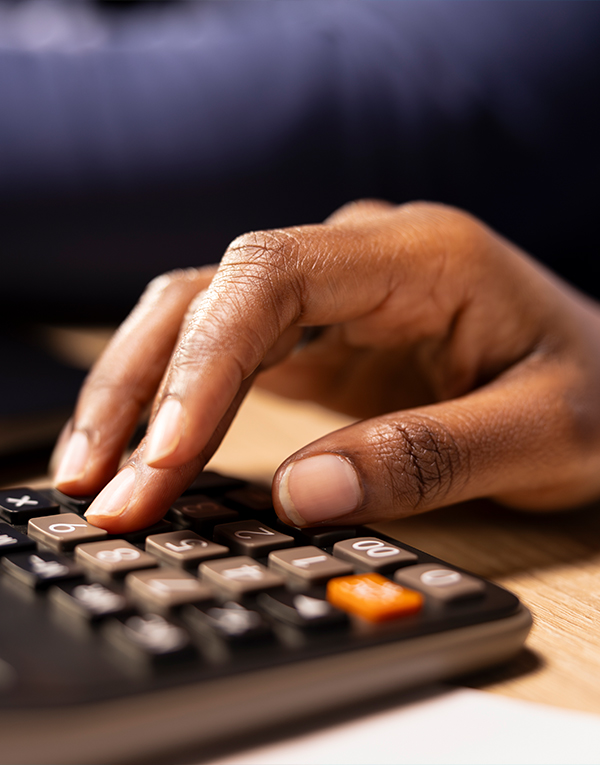 Hand using a calculator